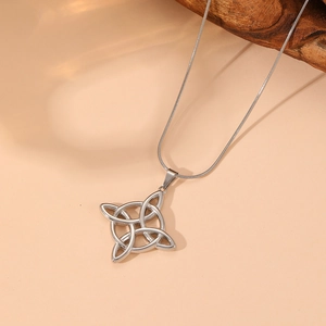 Detailed view of silver stainless steel Celtic knot pendant with opal and snake chain