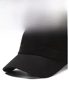 Detailed close-up of a durable black flat top cap brim with reinforced double stitching