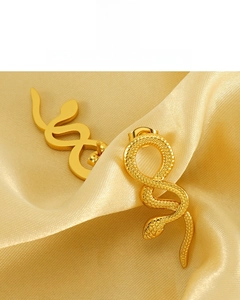 Detail of 18k gold plated snake earrings showing scales texture and polished finish