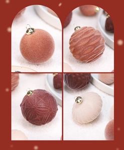 Detailed view of flocked velvet Christmas ornaments in orange, brown, and beige tones