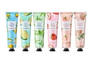 Set of six assorted fruit and botanical scented moisturizing hand creams on white background