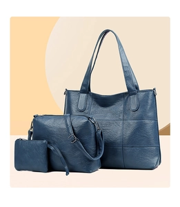 Three-piece dark blue lychee grain leather tote set with shoulder bag and small wallet pouch
