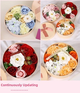 Detail view of round soap flower gift boxes with roses, carnations and elegant ribbons
