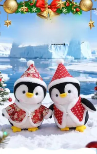 Detail of plush Christmas penguins in floral and Nordic festive outfits on snow