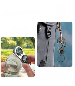 Multifunctional compass keychain with bottle opener used on backpack in outdoor setting