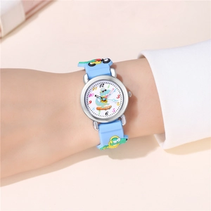 Close-up of blue kids' watch with 3D dinosaur silicone strap on a child's wrist