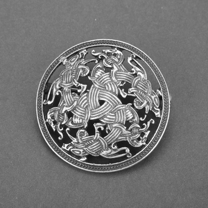 Vintage Viking metal shield brooch with Celtic knot animal patterns in antique silver finish