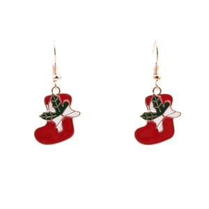 Festive red Christmas stocking earrings with green holly and gold metal on white background