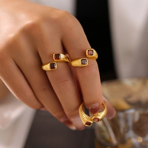 Vintage geometric red zircon ring with gold plating and adjustable spiral texture on finger