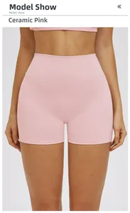 Detail view of high waist ceramic pink yoga shorts with ribbed texture and lift effect
