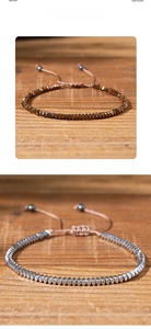 Detail of adjustable hematite bead bracelets with metallic finish and braided cord