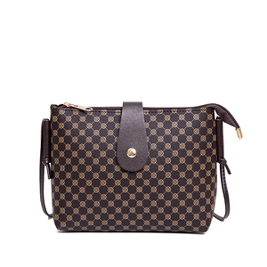 Retro brown bucket shoulder bag with clover geometric prints and a metallic flap closure