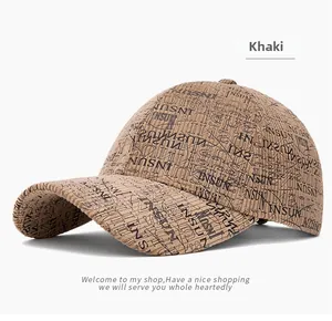 Detail of khaki corduroy baseball cap with vintage letter pattern and ribbed texture