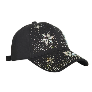 Black baseball cap with floral rhinestone patterns and adjustable strap, 45-degree view