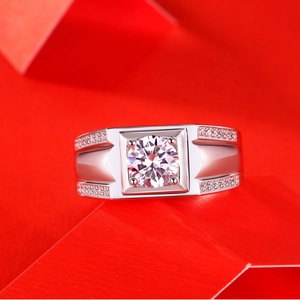 Macro detail of men's S925 silver moissanite ring with four-prong setting and side stones