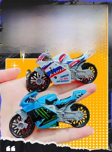 Detailed view of stylized motorcycle model keychain with vibrant colors and race decals
