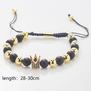 Detail of adjustable beaded crown bracelet with matte black stones and 28-30cm size label