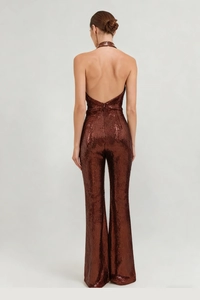 Detailed back view of a copper sequined halter jumpsuit with open back and wide legs