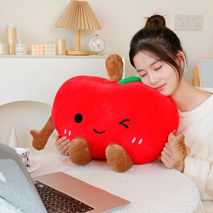 Cute red apple plush pillow with personified facial expression and soft green leaf