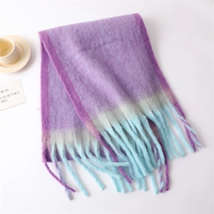 Detail of purple and light blue gradient knitted scarf with stylish tassel edges