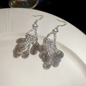 Elegant silver leaf tassel drop earrings with sparkling rhinestones and bohemian feather charms