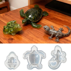 Silicone molds for resin featuring frog, turtle, and lizard shapes in clear detail