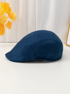 Detail showing breathable mesh texture and navy blue fabric of the linen flat cap
