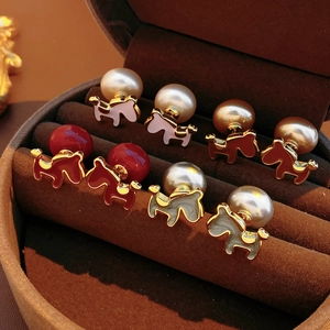 Detailed close-up of 18K gold plated pony and pearl earrings in multiple enamel colors