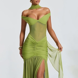 Detailed view of green strapless mesh dress with ruching and high leg slit detail