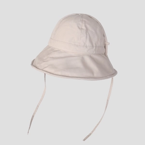 Detail view of cream white sun hat with adjustable strap for outdoor uv protection