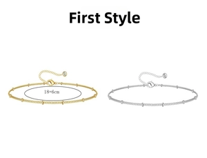 Detail of beaded link anklet set in gold and silver with lobster clasp and crystal charm