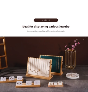 Detail of wooden necklace display boards with velvet padding and earring stands set