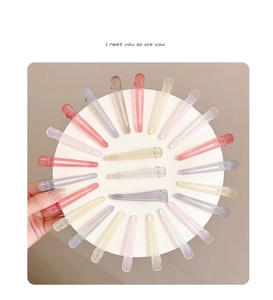 Macro detail of assorted pastel matte hair clips in a circular aesthetic arrangement