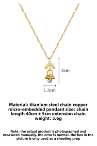 Detail of gold bow bell pendant with zircons showing dimensions and titanium steel chain