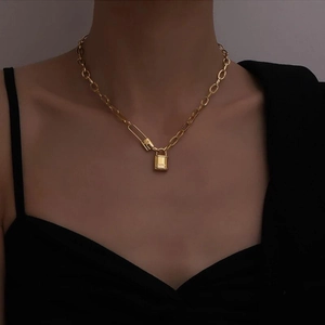 Retro stainless steel gold necklace with padlock pendant and paperclip chain on model