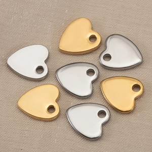 Polished heart-shaped stainless steel charms for DIY jewelry making in gold and silver