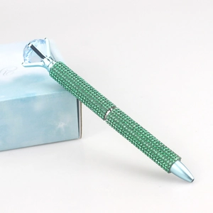 Sparkling green rhinestone ballpoint pen with large crystal topper on blue gift box
