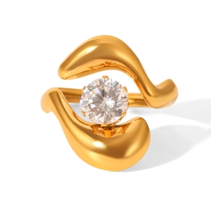 Close-up of golden wavy ring with round diamond center on a clean white background
