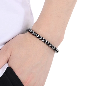 Silver-black stainless steel wheat chain bracelet for women featuring spring clasp detail