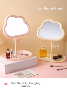 Detailed view of cloud-shaped vanity mirror with star hook and pink jewelry tray