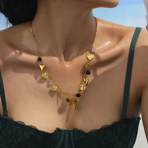 Golden multilayer necklace with colorful heart, sun, and eye charms for summer vacation style