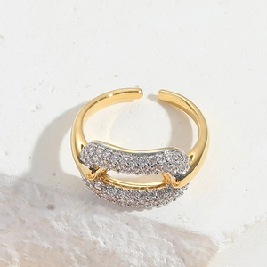 Detail of adjustable gold ring with double rows of pavé set white zircon stones