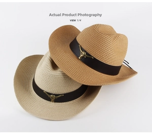 Close-up of woven straw cowboy hat featuring vintage bull head metal ornament detail