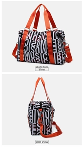 Detail view of large capacity fitness bag with black letter print and orange straps