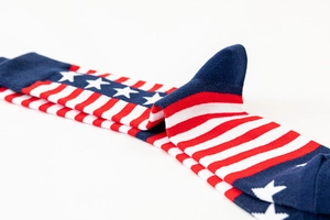 Detail shot of cotton socks featuring American flag pattern with stars and stripes design