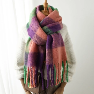 Thick warm checkered scarf with long tassels in purple, orange, and green colors