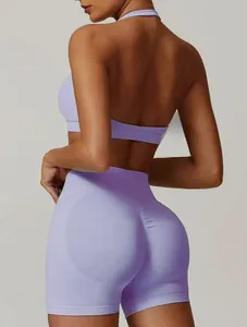 Rear view of purple high-waist yoga shorts and halter top in ribbed elastic fabric