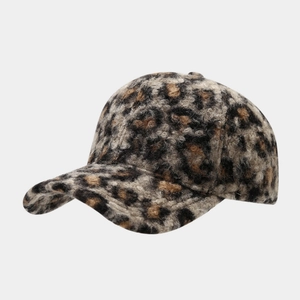 Close-up of leopard print baseball cap featuring soft faux fur texture for winter warmth