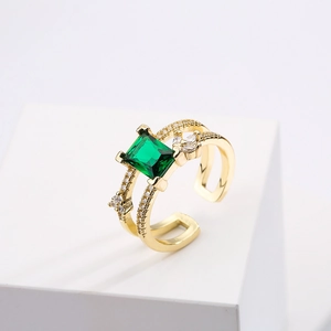 Minimalist 18K gold plated ring featuring a square green zircon and white side stones