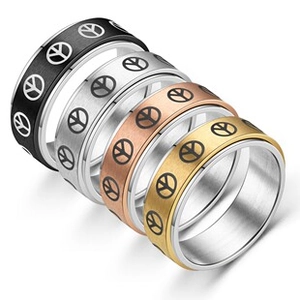 Detailed view of peace sign rings in black silver rose gold and gold finish colors